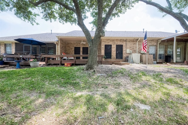 back of house featuring a deck