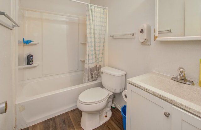 full bathroom with hardwood / wood-style flooring, vanity, toilet, and shower / bath combo with shower curtain