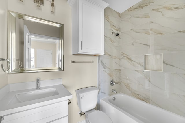 full bathroom featuring vanity, toilet, and tiled shower / bath combo