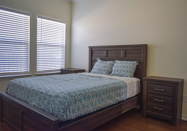 bedroom featuring dark hardwood / wood-style flooring