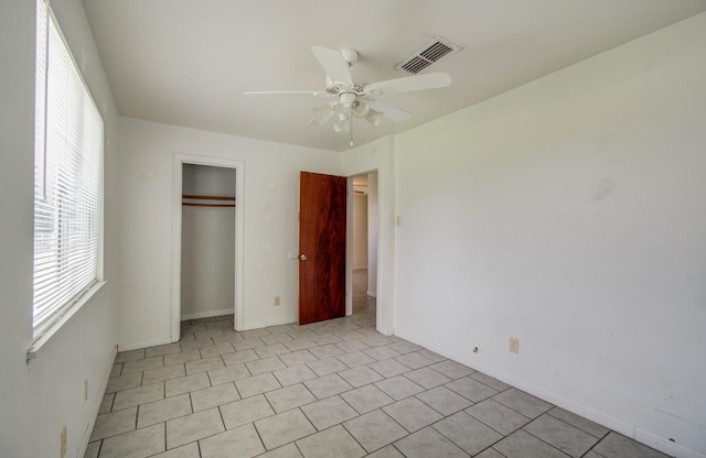 unfurnished bedroom featuring ceiling fan