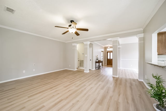 unfurnished living room with ceiling fan, light hardwood / wood-style floors, ornamental molding, and decorative columns