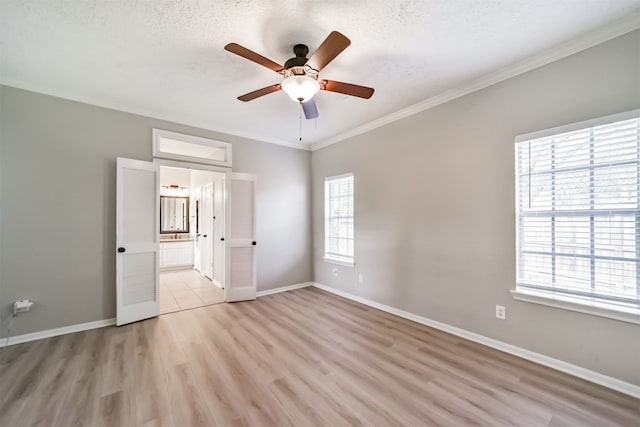 unfurnished bedroom with multiple windows, ceiling fan, light hardwood / wood-style flooring, and ornamental molding