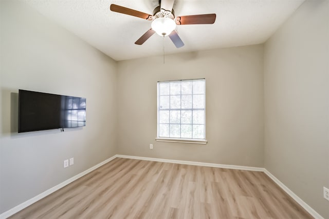 unfurnished room featuring ceiling fan and light hardwood / wood-style floors