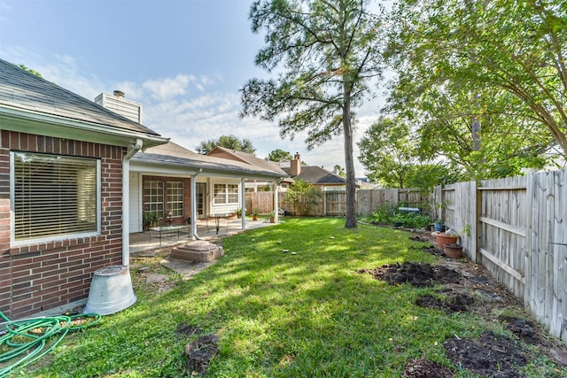 view of yard with a patio area