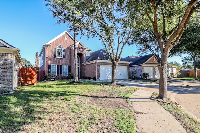 view of front of property with a garage and a front yard