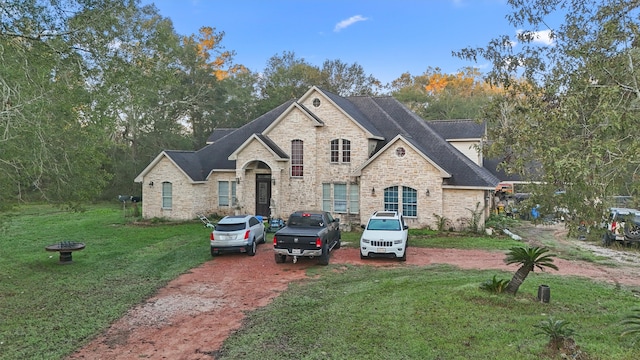 french country home with a front yard