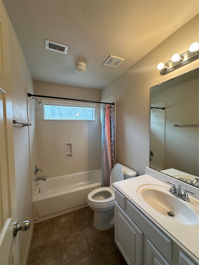 full bathroom with tile patterned floors, vanity, a textured ceiling, shower / bathtub combination with curtain, and toilet