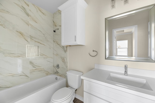 full bathroom featuring vanity, toilet, and tiled shower / bath