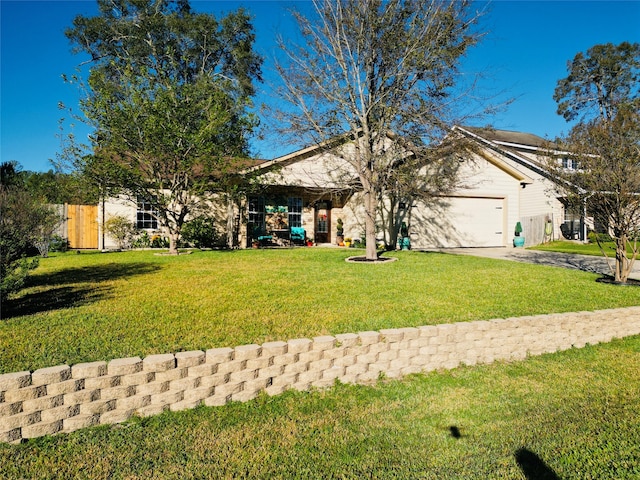 view of front facade with a garage and a front lawn