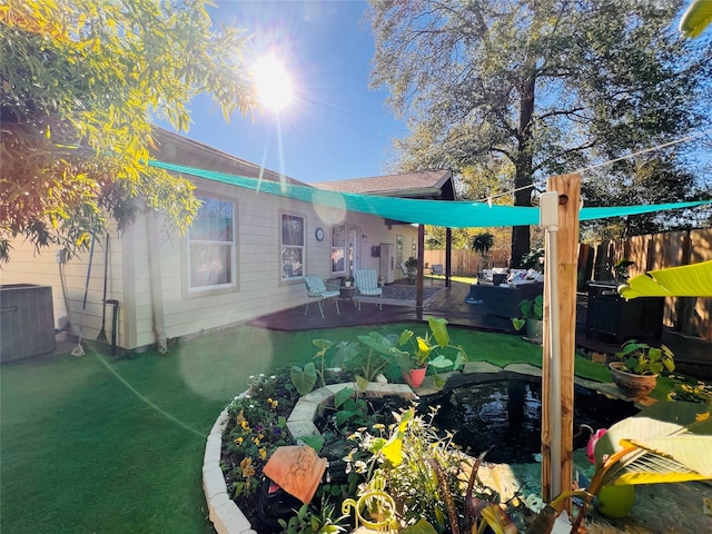 rear view of house with central AC unit and a patio area