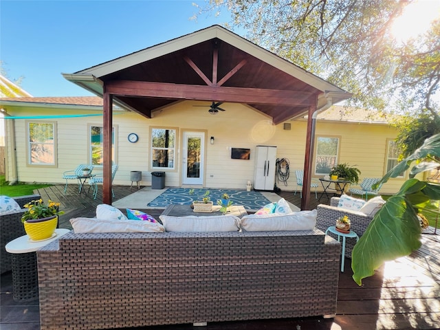 back of property with outdoor lounge area and a deck