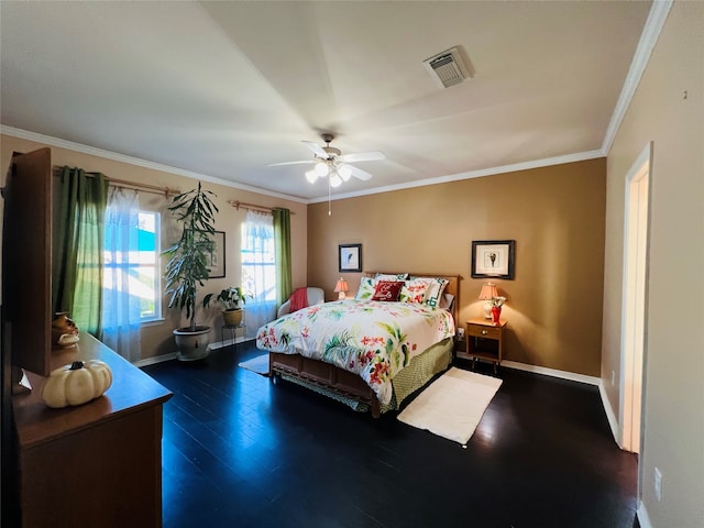 bedroom featuring ceiling fan, ornamental molding, and dark wood-type flooring