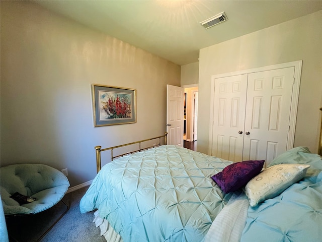 carpeted bedroom with a closet