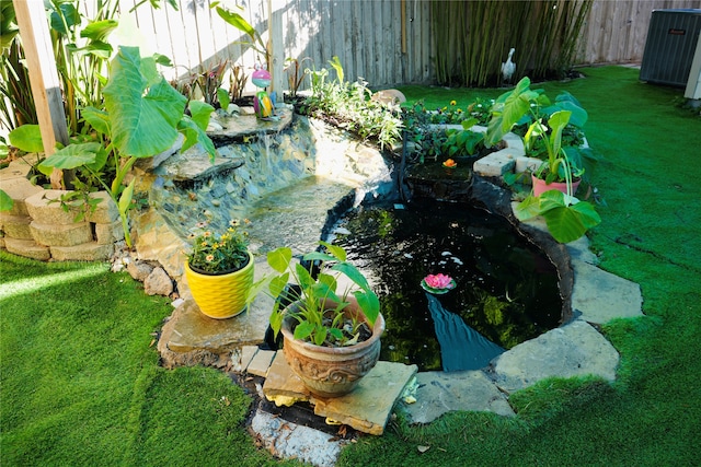 view of yard featuring a garden pond