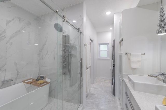 bathroom with independent shower and bath and vanity