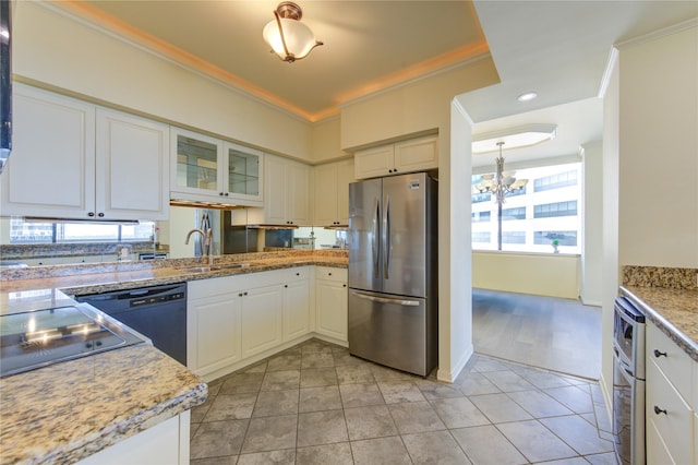 kitchen with ornamental molding, stainless steel fridge, black dishwasher, and white cabinets