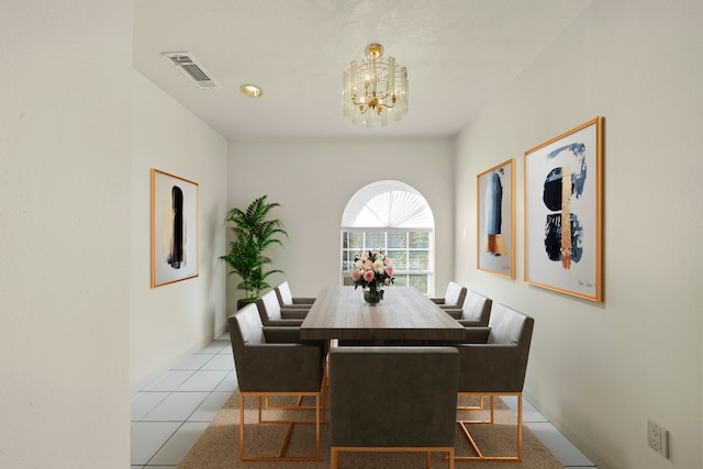 tiled dining area with an inviting chandelier