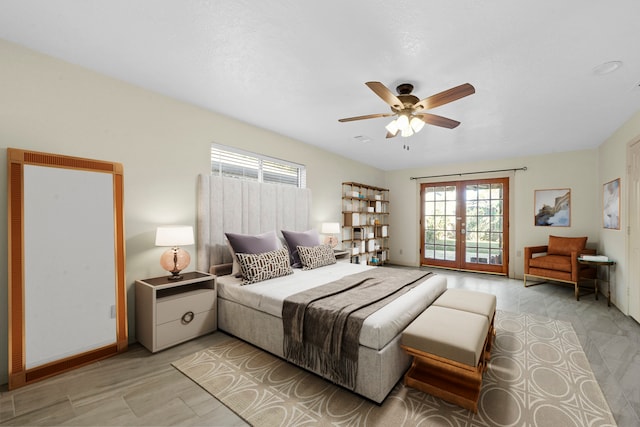 bedroom featuring ceiling fan and french doors