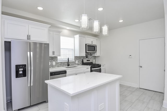 13754 Lynx Dr, Houston, TX 77014 - kitchen with appliances with stainless steel finishes, a sink, white cabinets, backsplash, and a center island
