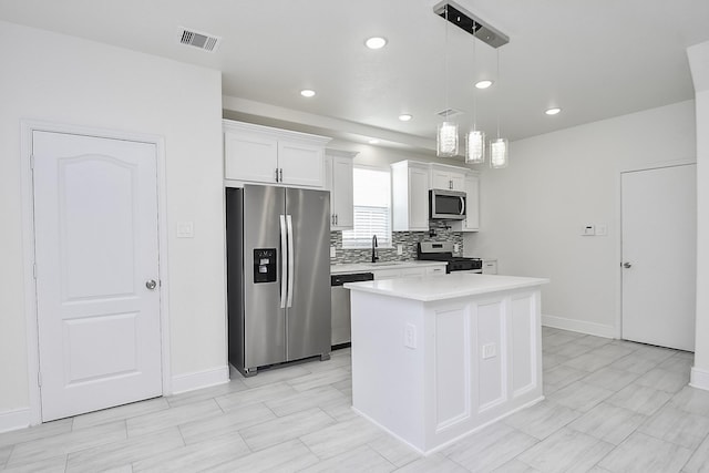13754 Lynx Dr, Houston, TX 77014 - kitchen featuring stainless steel appliances, baseboards, light countertops, white cabinetry, and backsplash