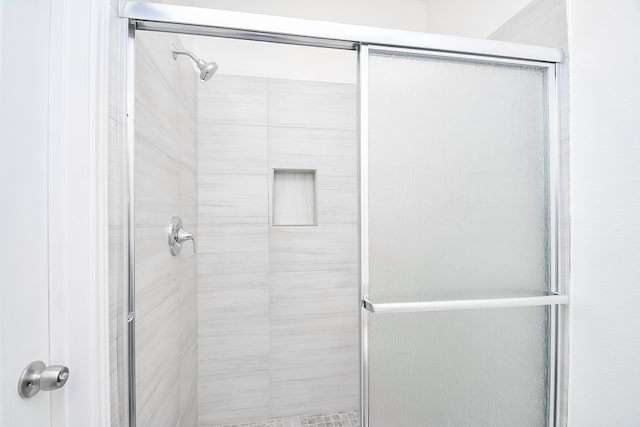 bathroom featuring walk in shower