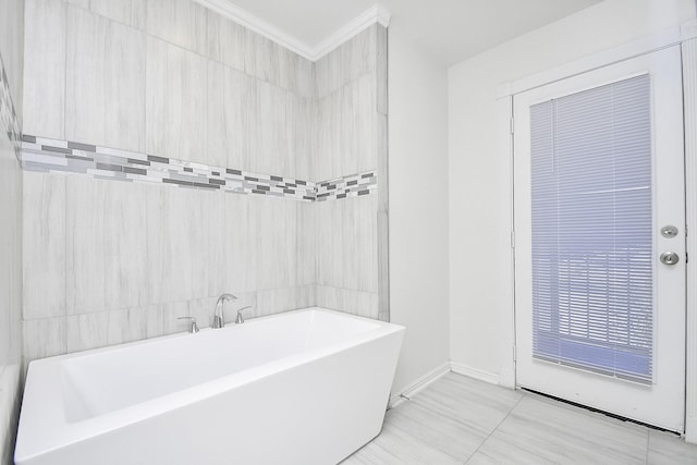 13754 Lynx Dr, Houston, TX 77014 - bathroom with a freestanding tub, baseboards, and ornamental molding