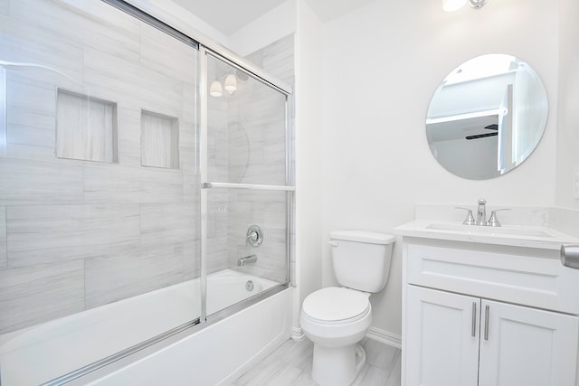 full bathroom with toilet, vanity, and combined bath / shower with glass door