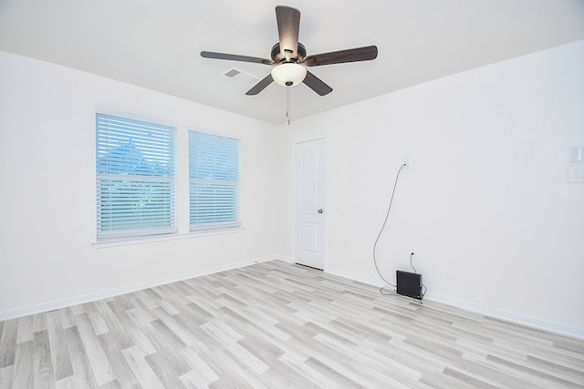 spare room featuring ceiling fan and light hardwood / wood-style flooring