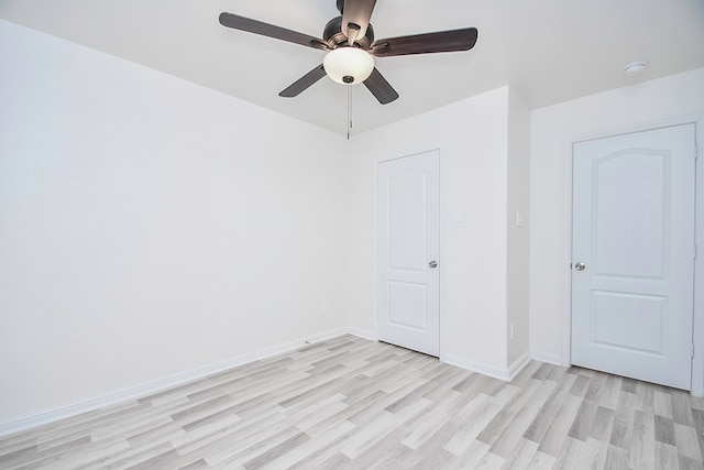 unfurnished bedroom featuring ceiling fan and light hardwood / wood-style flooring