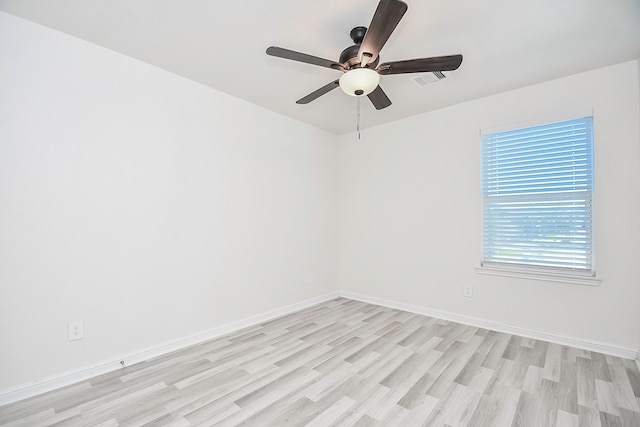 empty room with ceiling fan and light wood-type flooring