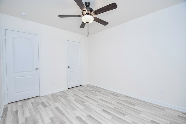 unfurnished bedroom with light hardwood / wood-style flooring and ceiling fan