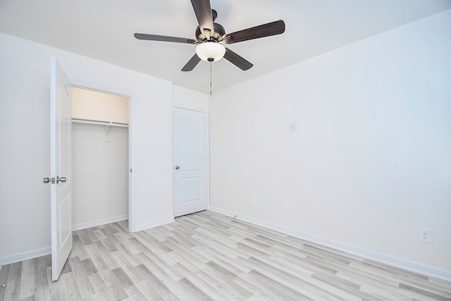 unfurnished bedroom with ceiling fan, light hardwood / wood-style floors, and a closet