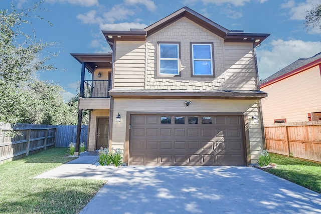 view of front of house featuring a balcony, a front lawn, and a garage