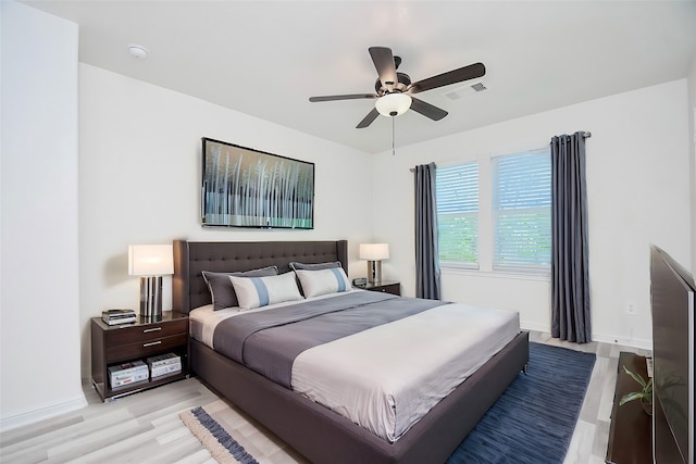 bedroom featuring ceiling fan and light hardwood / wood-style flooring