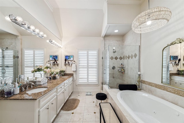 bathroom with an inviting chandelier, separate shower and tub, tile patterned floors, lofted ceiling, and vanity