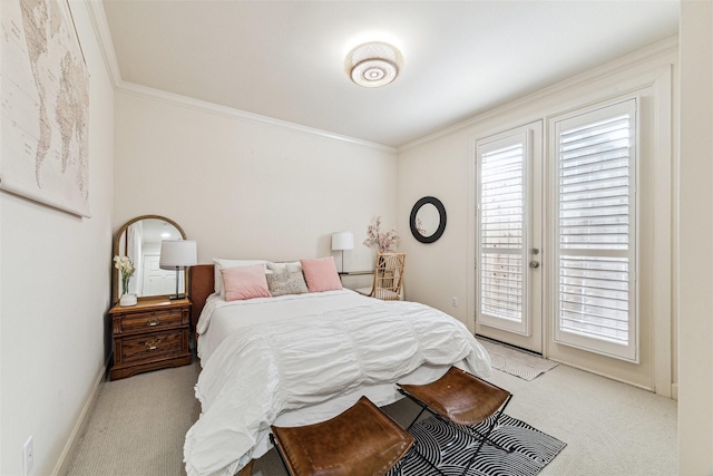 carpeted bedroom with access to outside and crown molding