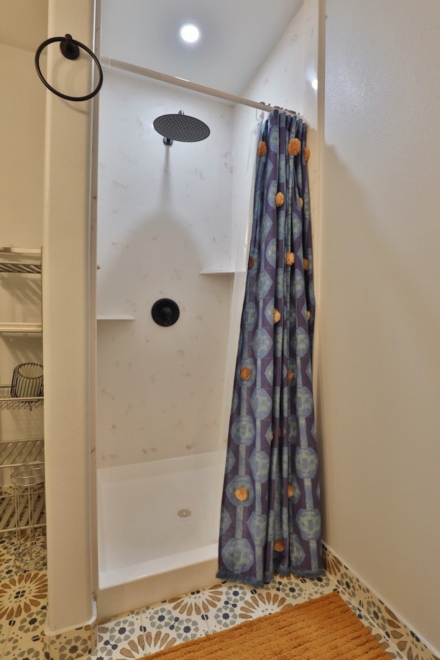 bathroom featuring tile patterned flooring and curtained shower