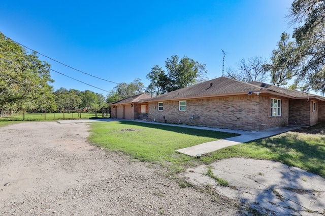 view of property exterior featuring a lawn