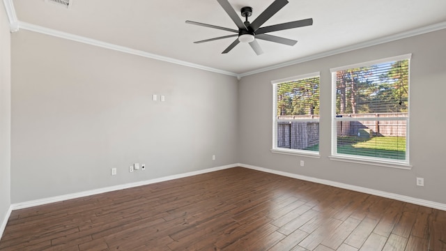 spare room with crown molding, ceiling fan, and dark wood-type flooring