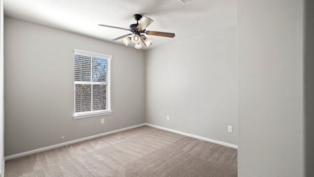 carpeted empty room with ceiling fan