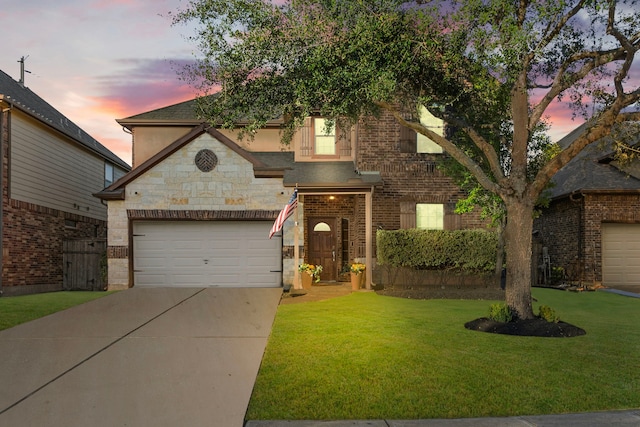 view of front of property with a lawn and a garage