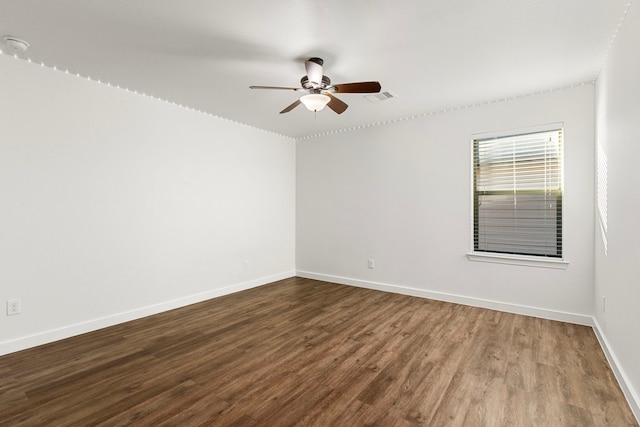 empty room with ceiling fan and wood-type flooring