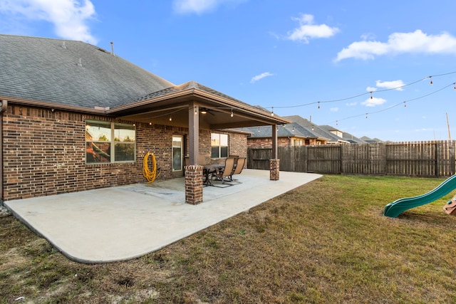 view of yard with a patio and a playground