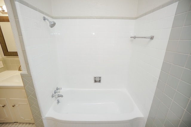 bathroom featuring shower / washtub combination and sink