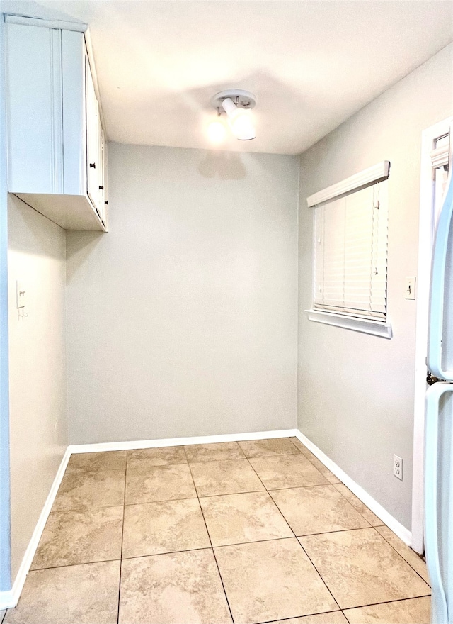 washroom with light tile patterned flooring