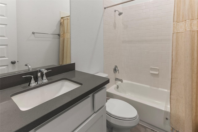 full bathroom featuring shower / tub combo with curtain, vanity, and toilet