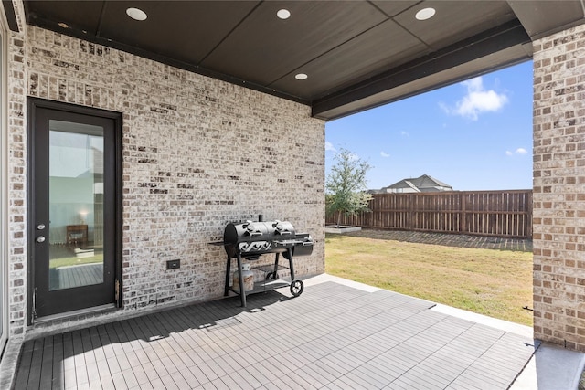 view of patio featuring a grill