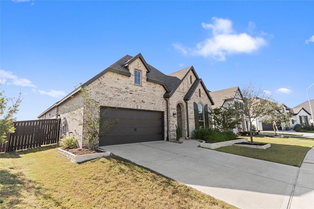 view of front facade with a front yard and a garage