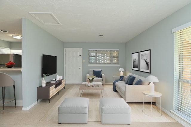 tiled living room with a textured ceiling